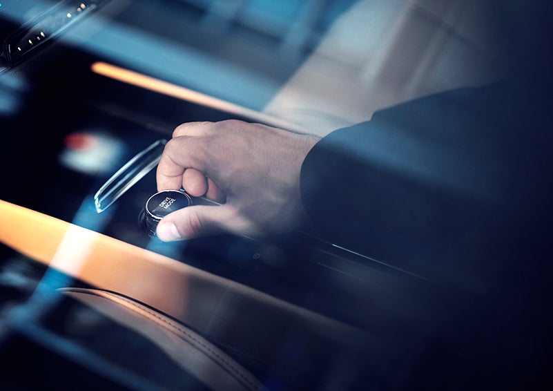 The driver of a 2023 Lincoln Corsair® SUV is shown adjusting the drive mode. | Miller Lincoln in Saint Cloud MN