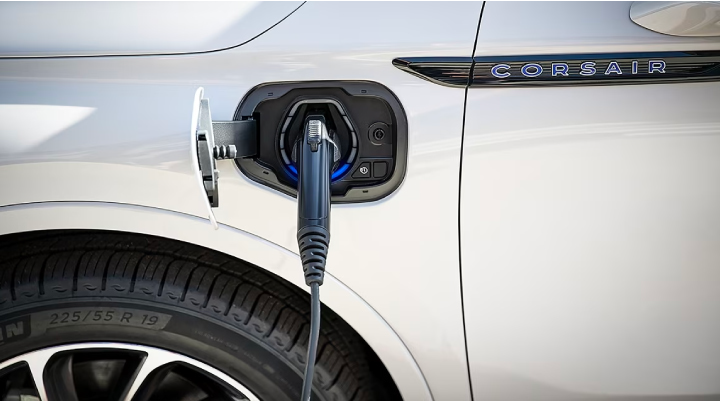 An electric charger is shown plugged into the charging port of a Lincoln Corsair® Grand Touring
model. | Miller Lincoln in Saint Cloud MN