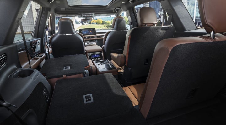 One side of the PowerFold® third-row seat and a second-row seat are folded forward in the 2026 Lincoln Aviator® SUV. | Miller Lincoln in Saint Cloud MN
