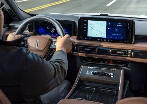 A person is driving a 2026 Lincoln Aviator® SUV as seen from inside the cabin. | Miller Lincoln in Saint Cloud MN