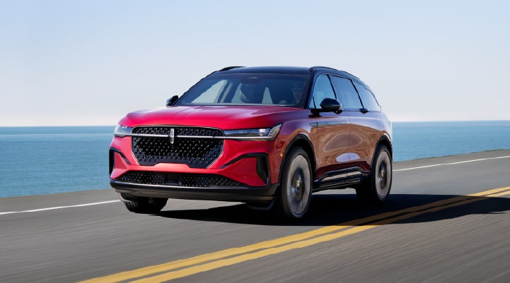 A 2026 Lincoln Nautilus® SUV is being driven on a seaside roadway. | Miller Lincoln in Saint Cloud MN