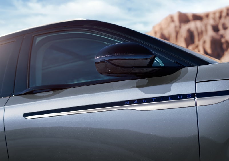 Blue lettering on the side of the vehicle that reads Nautilus indicates the available Hybrid Powertrain. | Miller Lincoln in Saint Cloud MN