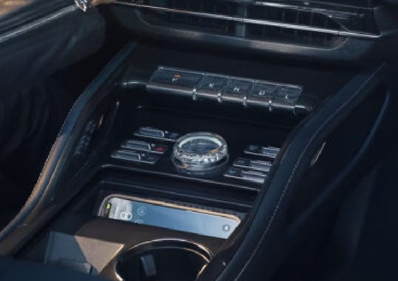 A smartphone is shown charging in the wireless charging pad. | Miller Lincoln in Saint Cloud MN