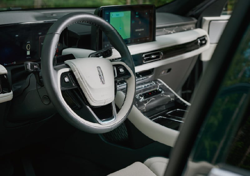 The leather-trimmed steering wheel of a 2027 Lincoln Aviator® Black Label™ SUV. | Miller Lincoln in Saint Cloud MN